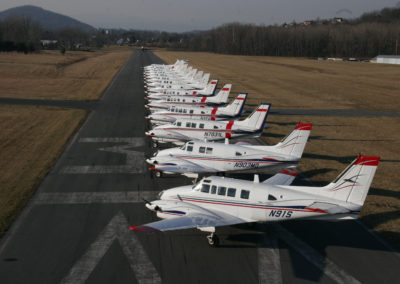 15 King Airs lined up parallel on runway