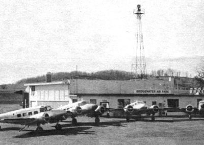 Black and white photo of planes outside of small airpark. 1982